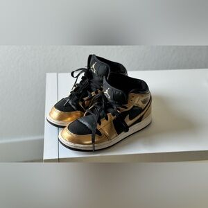 Youth size 4 Air Jordans gold and black